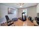 Home gym features wood floors, exercise equipment, neutral paint and great natural light at 29 Fern Leaf Ct, Dallas, GA 30157