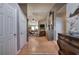 Hallway leading into a living room; hardwood floors, neutral walls, and stylish decor add to the home's charm at 29 Fern Leaf Ct, Dallas, GA 30157