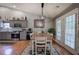 Kitchen with gray cabinets, stainless steel appliances, and adjacent dining area with French doors at 29 Fern Leaf Ct, Dallas, GA 30157