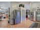 Spacious kitchen features stainless steel appliances, hardwood floors and view to other rooms at 29 Fern Leaf Ct, Dallas, GA 30157