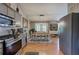 Lovely eat-in kitchen area boasts stainless appliances and hardwood flooring at 29 Fern Leaf Ct, Dallas, GA 30157