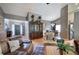 Open-concept living area with view of entry, dining, and kitchen, featuring neutral decor and hardwood floors at 29 Fern Leaf Ct, Dallas, GA 30157