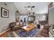 Spacious living room with leather sofas, area rug, and view of dining area at 29 Fern Leaf Ct, Dallas, GA 30157