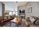 Living room with hardwood floors, neutral gray walls, fireplace, and ample seating, perfect for entertaining at 29 Fern Leaf Ct, Dallas, GA 30157