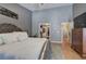 Relaxing primary bedroom with walk-in closet and gray walls at 29 Fern Leaf Ct, Dallas, GA 30157