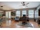 Bright home office space with natural light, hardwood floors, and a ceiling fan at 29 Fern Leaf Ct, Dallas, GA 30157