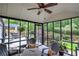 Enjoy this relaxing screened porch with an outdoor view and an adjacent deck space at 29 Fern Leaf Ct, Dallas, GA 30157