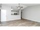 Inviting living room featuring vaulted ceilings and open floor plan with luxury vinyl plank flooring at 5477 Hedgeflower Ct, Stone Mountain, GA 30088