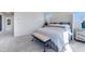 Tastefully staged bedroom featuring a luxurious bed and bench at 95 Wilder Ridge Way, Lawrenceville, GA 30044