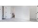 Empty bedroom with neutral carpet and an ensuite bathroom with a large closet at 95 Wilder Ridge Way, Lawrenceville, GA 30044