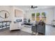 Stylish living room offering modern furniture, fireplace, large windows and an open layout at 95 Wilder Ridge Way, Lawrenceville, GA 30044