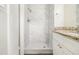 Bathroom featuring walk-in shower with white tile, granite counter top, and modern fixtures at 3129 Thrasher Cir, Decatur, GA 30032