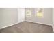 Cozy bedroom with neutral carpet, natural light, and closet at 3129 Thrasher Cir, Decatur, GA 30032