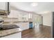 Bright kitchen with white cabinets, stainless appliances, granite counters, with sliding door to outdoor space at 3129 Thrasher Cir, Decatur, GA 30032