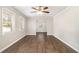 Spacious living room with hardwood floors, neutral walls, white trim, and natural light from multiple windows at 3129 Thrasher Cir, Decatur, GA 30032