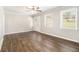 Bright living room with hardwood floors, neutral walls, white trim, and natural light from large windows at 3129 Thrasher Cir, Decatur, GA 30032