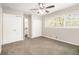 Large main bedroom with gray carpet, neutral walls, ample closet space, and natural light from two windows at 3129 Thrasher Cir, Decatur, GA 30032