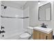 Bathroom featuring a shower-tub combo and modern wood vanity with a sleek black faucet at 3185 Laventure Dr, Chamblee, GA 30341