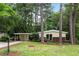 Charming single-story home featuring brick accents, a covered carport, and a well-maintained front yard at 3185 Laventure Dr, Chamblee, GA 30341