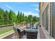 Inviting back deck offers serene outdoor seating with wooded views and a tranquil setting at 5330 Cole Creek Ln, Cumming, GA 30040