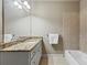 Bathroom with vanity, granite countertop, and tiled shower at 5330 Cole Creek Ln, Cumming, GA 30040