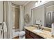 Traditional bathroom features granite counters, bronze fixtures, and shower-tub combination at 5330 Cole Creek Ln, Cumming, GA 30040