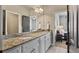 Bathroom with double sink vanity, granite countertops, and modern fixtures at 5330 Cole Creek Ln, Cumming, GA 30040