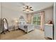 Bedroom with a ceiling fan, neutral-toned walls, and carpet flooring at 5330 Cole Creek Ln, Cumming, GA 30040