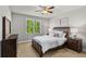 Cozy bedroom with a queen-sized bed, natural light, and stylish furnishings, perfect for relaxation at 5330 Cole Creek Ln, Cumming, GA 30040