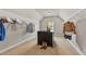 Walk-in closet has carpet floors, center island, and built-in shelves at 5330 Cole Creek Ln, Cumming, GA 30040