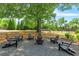 Community fire pit and seating area surrounded by lush landscaping and mature trees at 5330 Cole Creek Ln, Cumming, GA 30040