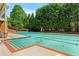 Community swimming pool with clean, clear water and poolside seating for residents to enjoy at 5330 Cole Creek Ln, Cumming, GA 30040