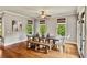 Cozy dining room with modern decor and ample sunlight from multiple windows at 5330 Cole Creek Ln, Cumming, GA 30040