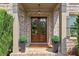 Charming front porch with double doors and decorative wreaths at 5330 Cole Creek Ln, Cumming, GA 30040