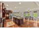 Spacious kitchen with stainless steel appliances, a center island, and a connected dining area at 5330 Cole Creek Ln, Cumming, GA 30040