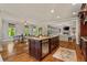 Open concept kitchen with island, dining area, and living room, perfect for entertaining and Gathering time at 5330 Cole Creek Ln, Cumming, GA 30040