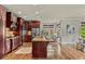 Gourmet kitchen with stainless steel appliances, granite countertops, and a large center island at 5330 Cole Creek Ln, Cumming, GA 30040