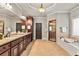 Bright main bathroom with walk-in shower, soaking tub, and double vanities at 5330 Cole Creek Ln, Cumming, GA 30040