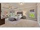 Spacious main bedroom with sitting area, tray ceilings, and plush carpet at 5330 Cole Creek Ln, Cumming, GA 30040