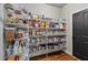Walk-in pantry features tons of shelving for plenty of storage space and organization at 5330 Cole Creek Ln, Cumming, GA 30040