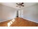 Bedroom with hardwood floors, ceiling fan, and closet at 1019 Magbee Se Dr, Smyrna, GA 30080