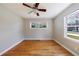 Bedroom with hardwood floors, ceiling fan, and natural light at 1019 Magbee Se Dr, Smyrna, GA 30080