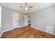 Bedroom with hardwood floors, ceiling fan, and dual closets at 1019 Magbee Se Dr, Smyrna, GA 30080