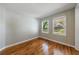 Bedroom featuring hardwood floors and ample natural light streaming in through the large windows at 1019 Magbee Se Dr, Smyrna, GA 30080