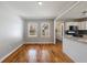 Dining area adjacent to kitchen, showcasing hardwood floors and natural light from the outdoor views at 1019 Magbee Se Dr, Smyrna, GA 30080