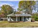 Exterior of cozy home with covered porch and well-maintained front lawn, perfect for first-time buyers at 1019 Magbee Se Dr, Smyrna, GA 30080