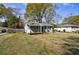 Exterior shot of home featuring well-manicured lawn and charming covered porch; a warm welcome awaits at 1019 Magbee Se Dr, Smyrna, GA 30080