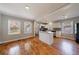 Spacious kitchen with island, stainless steel appliances, white cabinetry and hardwood flooring at 1019 Magbee Se Dr, Smyrna, GA 30080