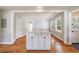 Open-concept kitchen island providing extra counter space in a kitchen with hardwood floors and plenty of natural light at 1019 Magbee Se Dr, Smyrna, GA 30080