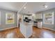 Updated kitchen with island, stainless steel appliances, subway tile backsplash and hardwood flooring at 1019 Magbee Se Dr, Smyrna, GA 30080